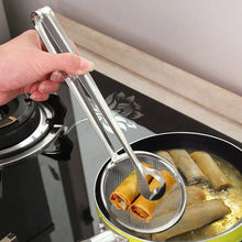 Stainless steel filter spoon with clip for frying and cooking.