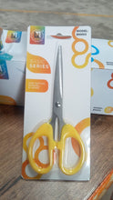 Stainless steel scissors with a focus on their sharp blades and ergonomic handle for precision cutting